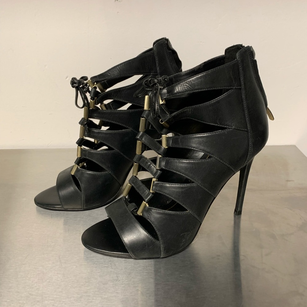 Woman’s black sandal.